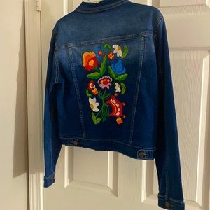 Large blue denim jacket with floral embroidery on back